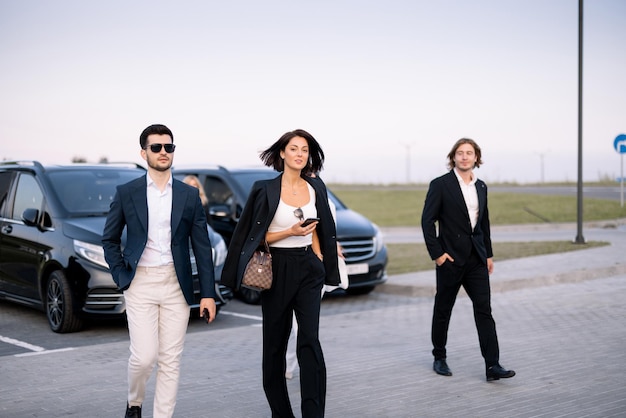 group elegant business people talk go parking lot arrived by business class taxis concept vehicle transfer business travel 506452 21725
